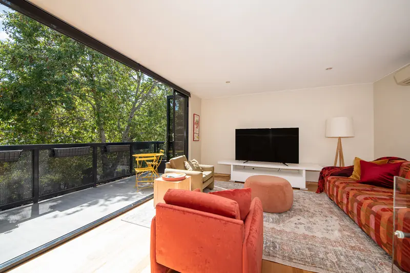 Living area seen from the terrace through full-height glazing