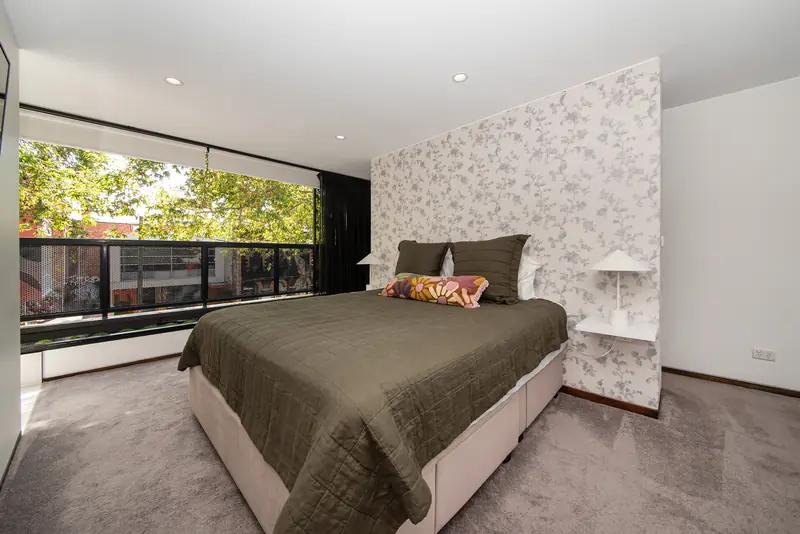 Main bedroom suite on its own private lower level, with garden outlook
